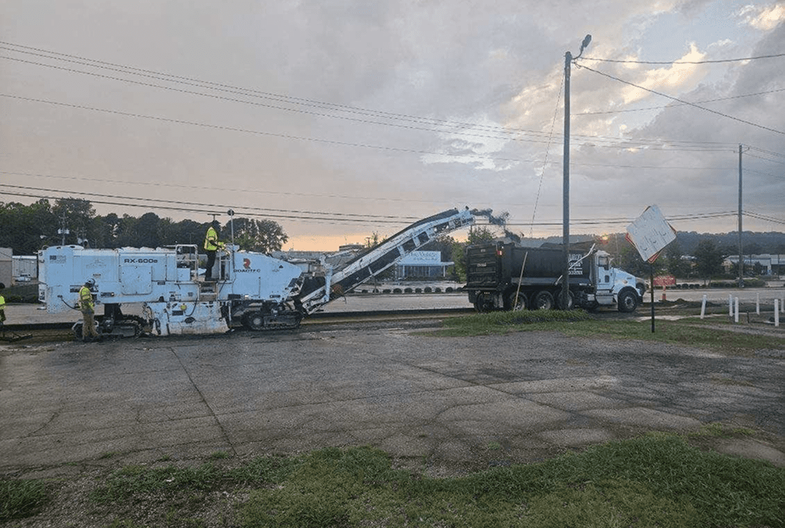 Highway maintenance under cloudy sky